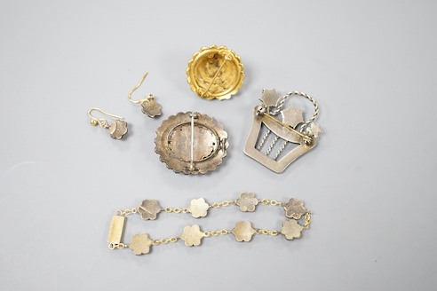 A Victorian gilt metal and facetted garnet set cluster brooch, 27mm, two other similar brooches, a bracelet and pair of earrings.